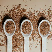 Three spoons full of flaxseed, an ingredient often included in horse diets